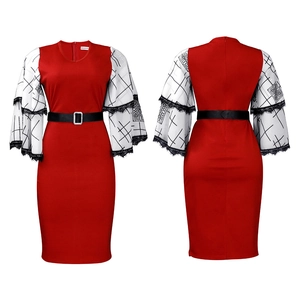 Detail of the V-neck red pencil dress showing flared printed sleeves and lace cuffs