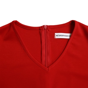 Detail view of the V-neckline and back zipper on a red knit pencil dress for women