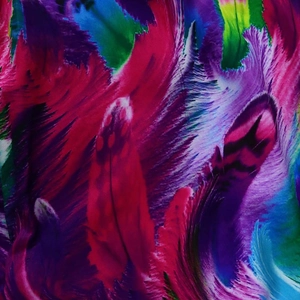 Close-up of vibrant floral and feather print fabric with fine textile texture detail