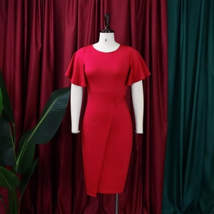 Detail of red bodycon dress featuring ruffle sleeves and asymmetric wrap skirt design