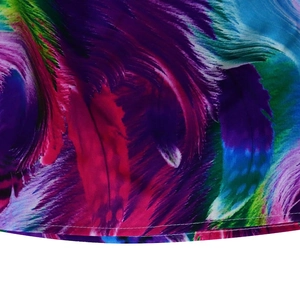 Detailed macro view of vibrant feather print fabric and fine stitching on summer dress