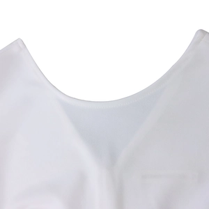 Detail of a white round neckline on a woven dress with clean single-needle stitching