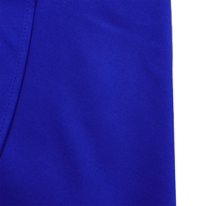 Macro shot of royal blue polyester twill fabric with precise stitching details
