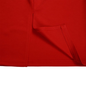 Detail of red knit dress hemline featuring a refined side slit and quality stitching