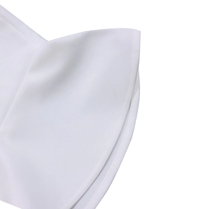 Close-up of white dress with layered ruffle sleeves and neat double-needle hemmed edges