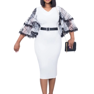 Detail of white pencil dress featuring black grid mesh flared sleeves and lace trim detail