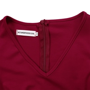 Detailed close-up of V-neckline with high-quality invisible zipper on burgundy dress