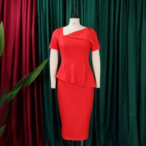 Detail of red asymmetric folded neckline and architectural pleats on dress
