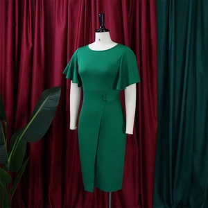 Detail of green dress featuring tiered ruffle sleeves and side slit with button accents