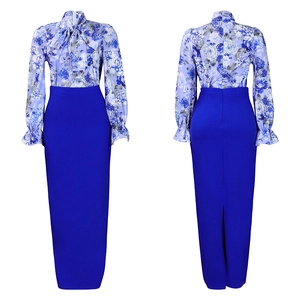 Dettaglio della camicia floreale blu con fiocco e della gonna lunga a vita alta blu reale