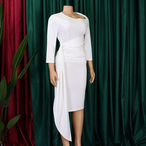 Detail of white midi dress showing asymmetric neckline and waist ruching details