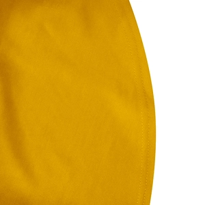 Macro shot of bright yellow ruffle sleeve edge with detailed double stitching