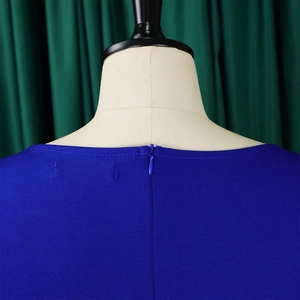 Detail of invisible back zipper closure on royal blue high waist pencil dress