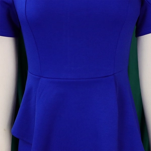 Detailed view of royal blue peplum waist design on stylish short-sleeved dress