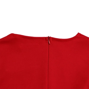 Detailed view of back invisible zipper and stitching on a professional red dress