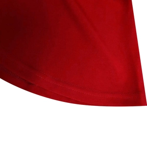Close-up of red high-waist dress hem showing double-row stitching and fabric texture