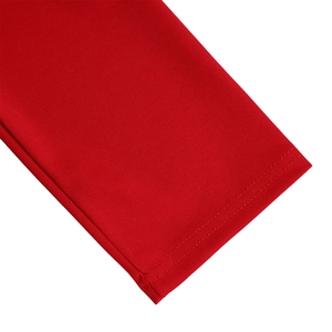 Detail of red knit dress cuff with professional double-needle stitching and fabric texture