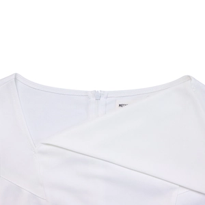 Detail of white dress featuring asymmetric collar and concealed back zipper closure