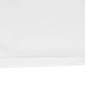 Close-up of white summer dress hem showing fine woven texture and double-needle stitching