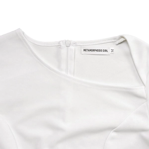 Detail of white dress neckline with asymmetrical cut and invisible back zipper