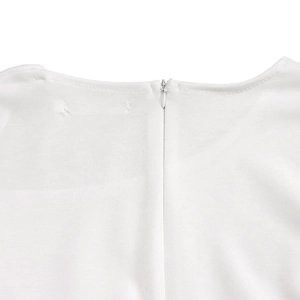 Close-up of white dress neckline featuring a seamless hidden zipper and premium fabric
