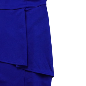 Macro shot of royal blue pencil dress showing detailed fabric texture and layered hem