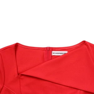 Close-up of invisible back zipper and brand tag on red high waist pencil dress