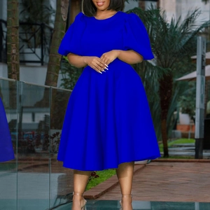 Detail view of the royal blue A-line dress featuring puff sleeves and a waist-cinched design