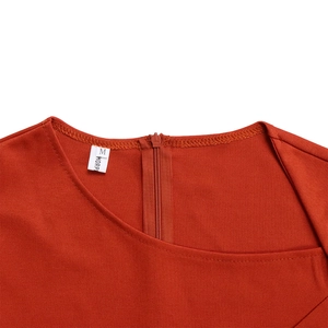 Detail of round neckline and back zipper on brick red stretch knit professional dress
