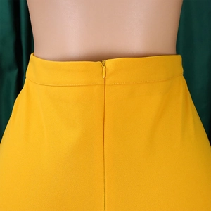 Detail of high waist wide leg pants showing seamless invisible zipper in bright yellow