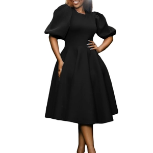 Detail of elegant black A-line dress with puff sleeves and cinched waist design