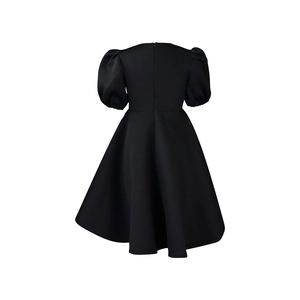Detail of elegant black A-line dress with puff sleeves and invisible back zipper