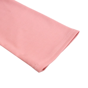 Close-up of pink knit dress sleeve with high-quality double-stitched hem finish
