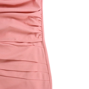 Detailed macro view of pink pleated office dress with precise horizontal stitching texture