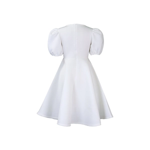 Detail of elegant white plus size dress featuring puff sleeves and back zipper closure
