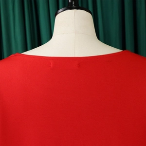 Macro detail of the straight neckline and fabric texture on a red elegant plus size top