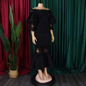 Detail of off-shoulder lace dress with bubble sleeves and elegant floral crochet hem