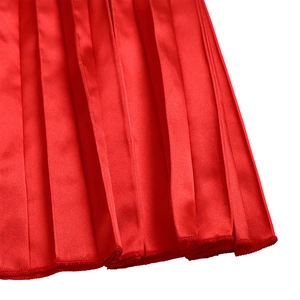 Detail of red pleated fabric with satin finish and high-quality hem stitching