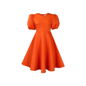 Close-up of bright orange A-line dress with puff sleeves and structured crew neck