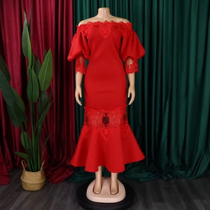 Close-up of red off-shoulder mermaid dress with lace patchwork and hollow lantern sleeves