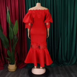 Detail of red off-shoulder mermaid dress featuring lace patchwork and bubble sleeves