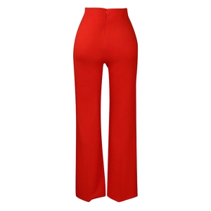 Detail view of red high waist wide-leg trousers featuring a hidden back zipper and straight cut