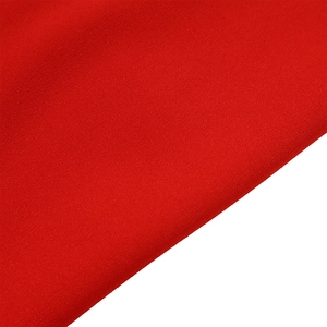 Macro detail of high-elasticity red fabric texture for high-waisted wide-leg trousers