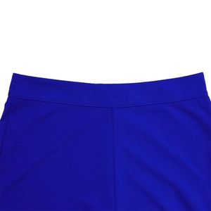 Detail of high-waist royal blue trousers with precise stitching and elastic fabric