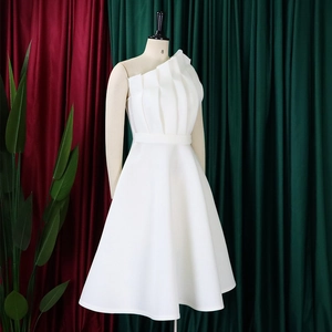 Detail of white one-shoulder dress with vertical pleated bodice and high waistline