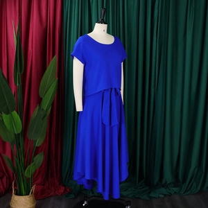 Detail of royal blue two-piece set featuring short sleeve top and belted maxi skirt