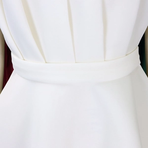 Detail of elegant white pleated waistline with sleek matching belt on a formal dress