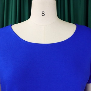 Detail of the minimalist round neckline on a royal blue elegant plus-size top