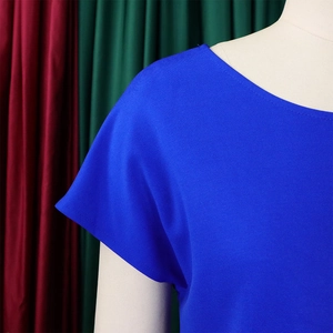 Close-up of royal blue round neck top showing detailed fine horizontal fabric texture