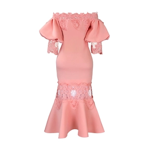 Detail of pink off-shoulder dress featuring intricate lace trim and elegant puff sleeves